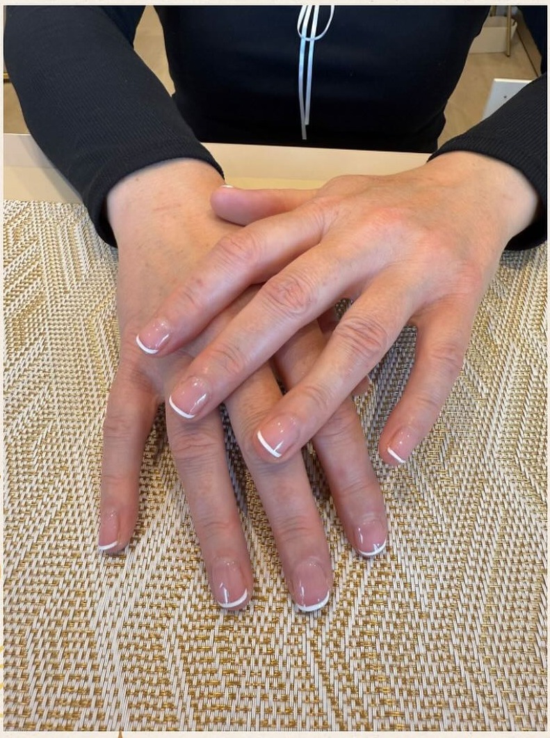 Classic white-tip French manicure on long square nails at Precious Moments Beauty Clinic, Banstead